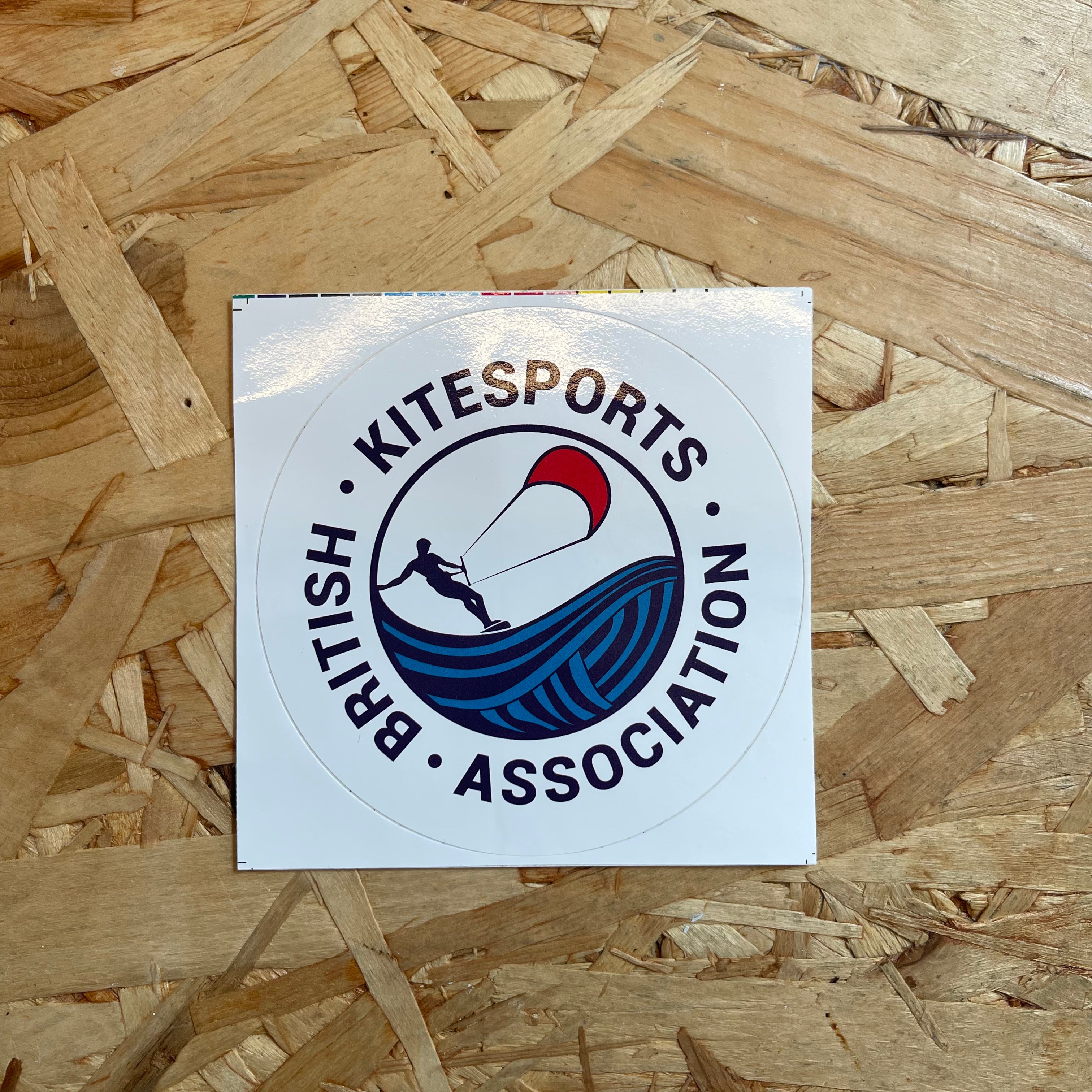 Sticker of the British Kitesports Association on a wooden surface