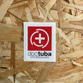 Doctuba kite specialists logo on a wooden background
