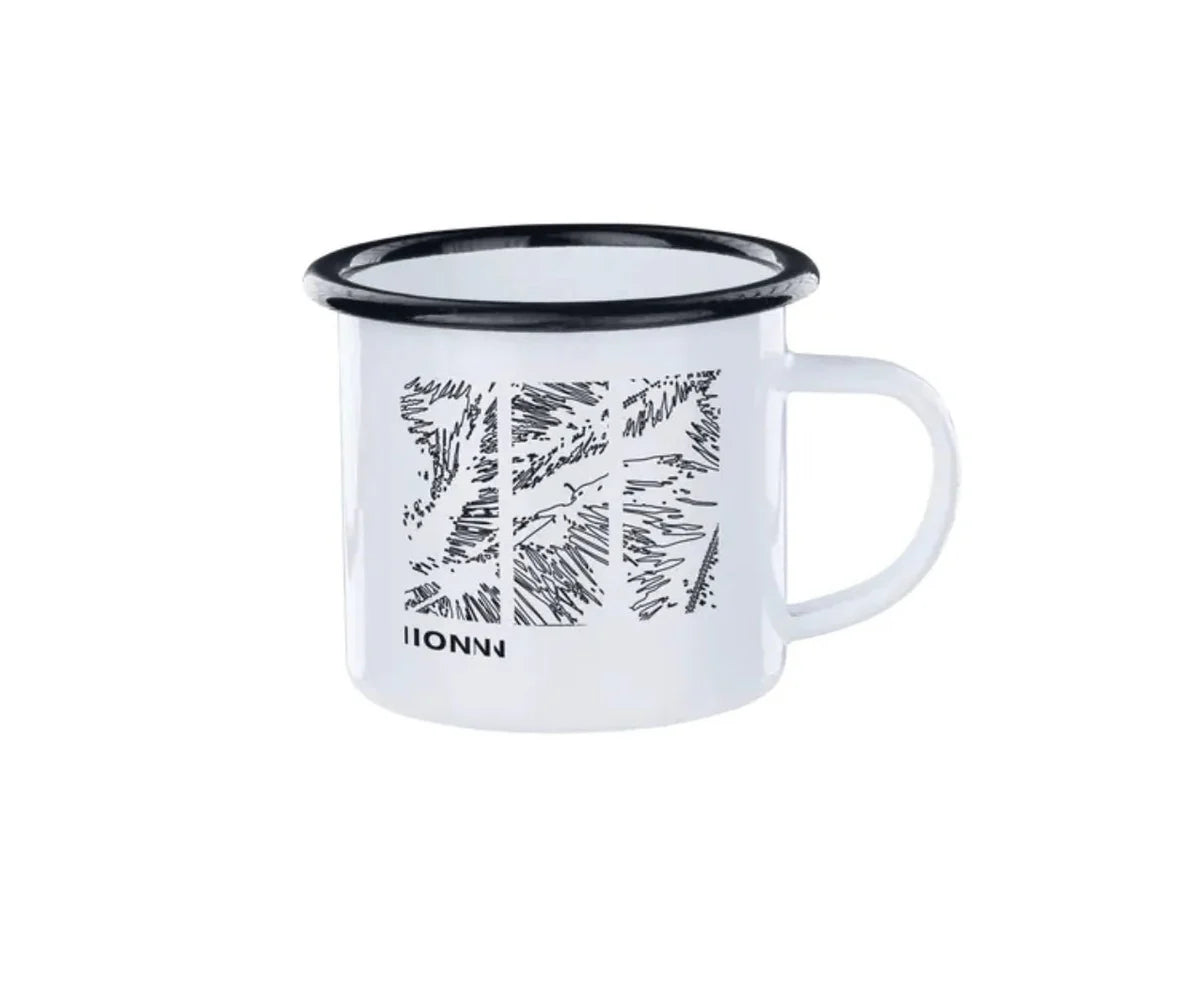 White enamel mug with black rim and leaf pattern on a white background