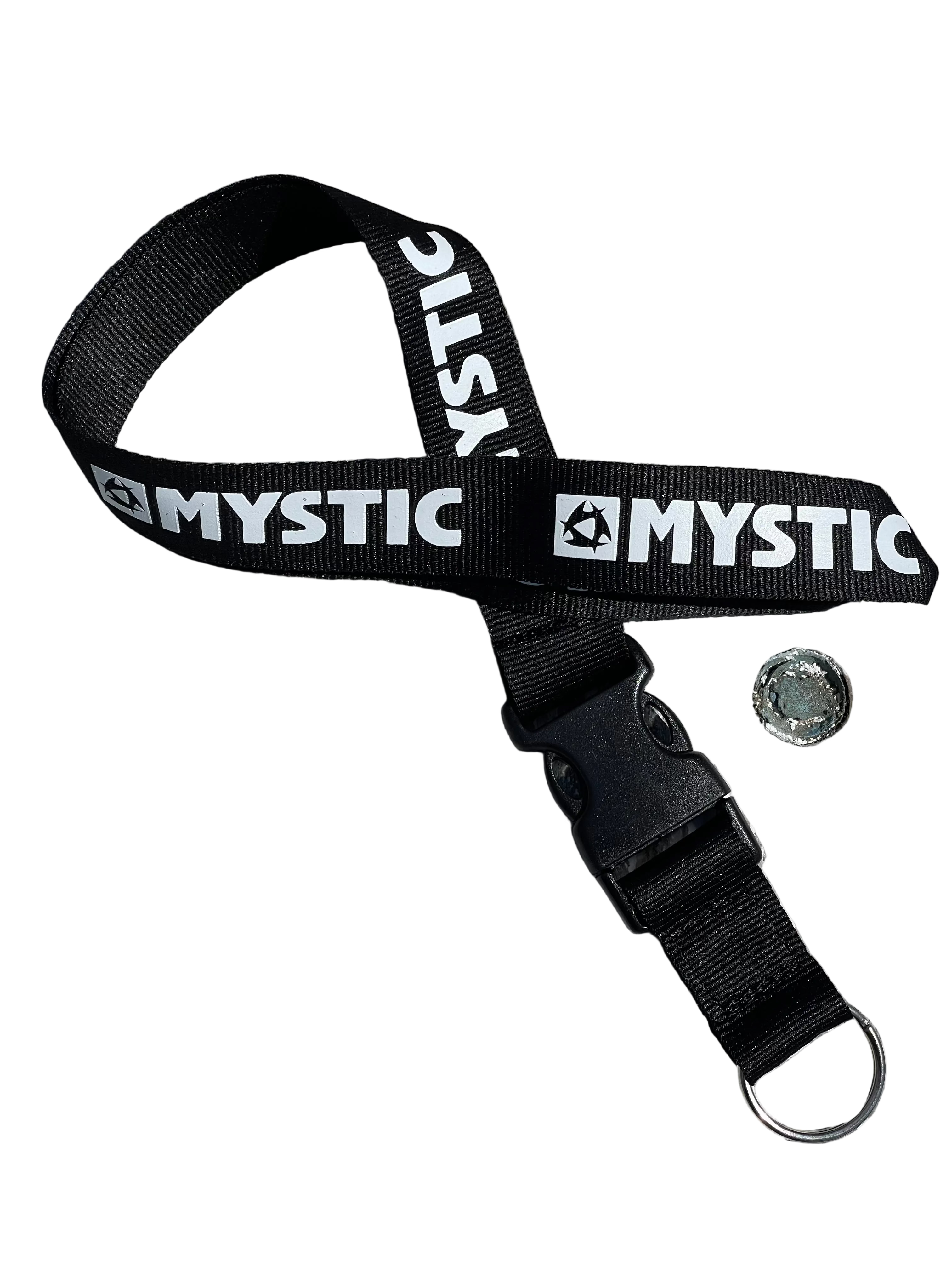 Black strap with 'Mystic' branding on a wooden surface