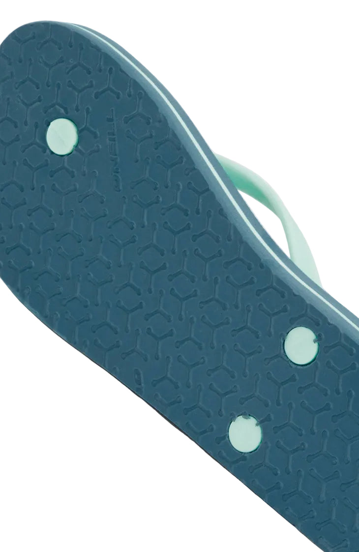 Close-up of a textured blue object with a handle on a light gray background